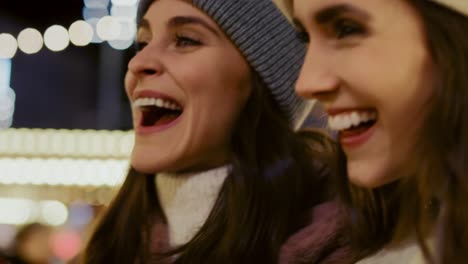 close up video of woman walking together across christmas market