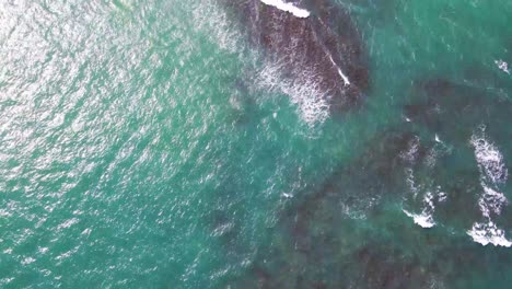 sunlight reflecting in the turquoise sea water