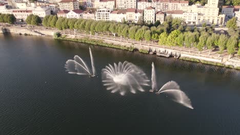 Fountain-and-water-games-on-Mondego-river-at-Coimbra,-Portugal