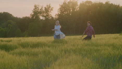 Couple in Love Running Through Fields at Sunset