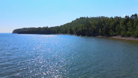 Lake-Superior-waters-and-Minnesota-forest-on-a-sunny-summer-day