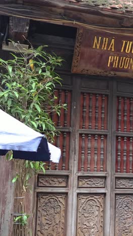 flags waving on a traditional wooden building