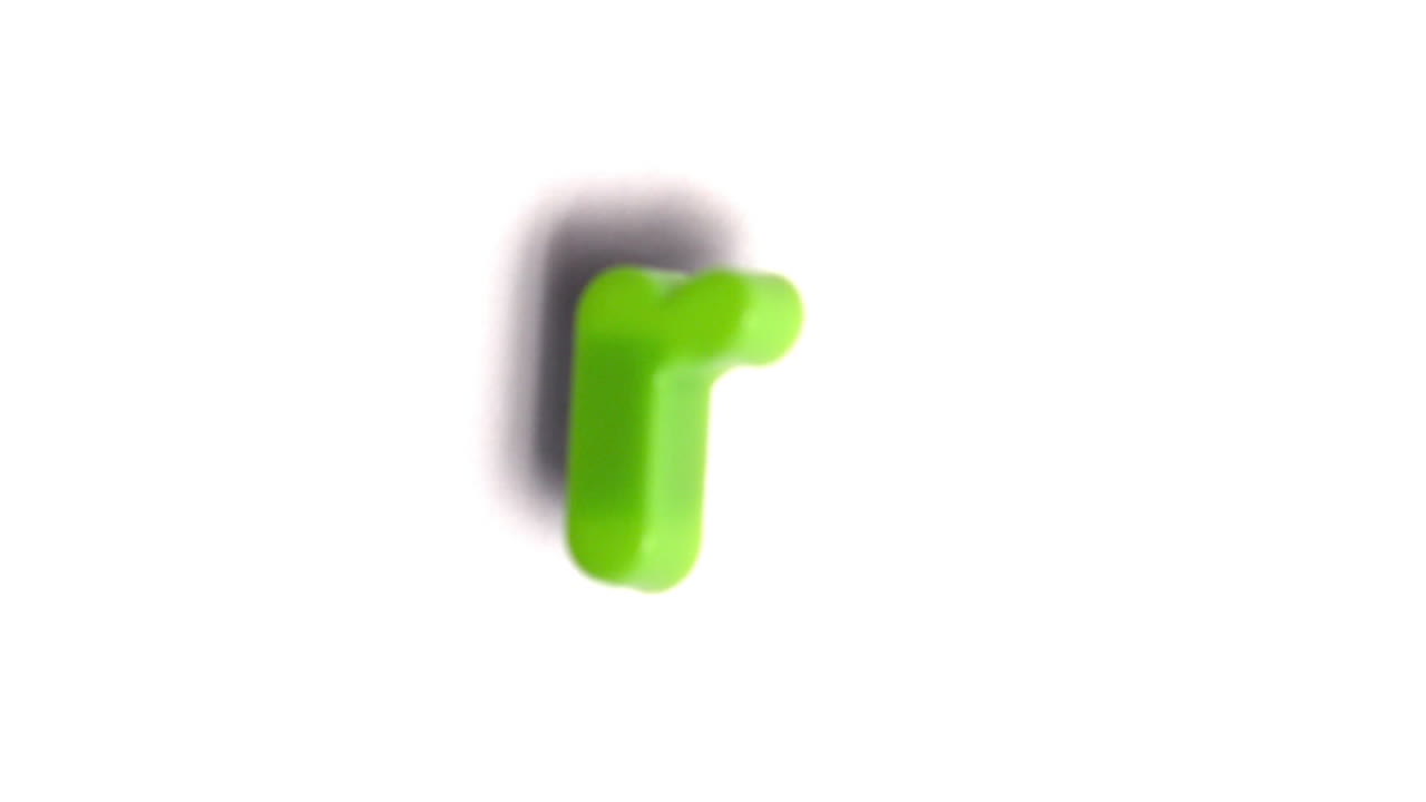 The letter r coming into focus on white background