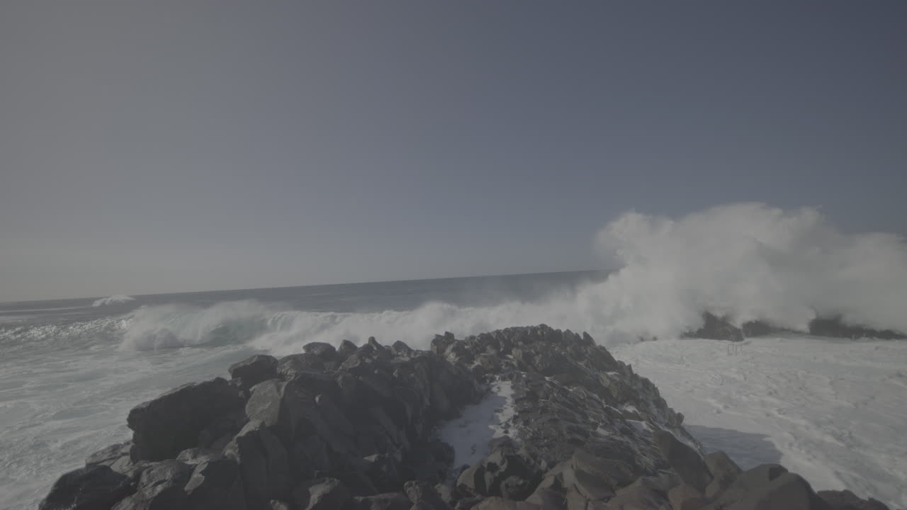 Powerful waves crashing against a rocky shore