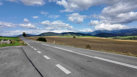 long stretch of road in picturesque countryside