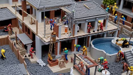 miniature construction workers are busy building a house with a swimming pool. showcasing the different stages of construction and the various tasks involved in bringing a residential project to life
