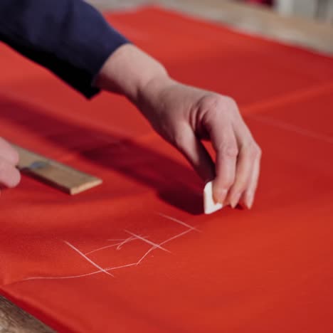 seamstress working with pattern