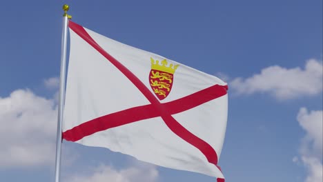 Bandera-De-Jersey-Moviéndose-En-El-Viento-Con-Un-Cielo-Azul-Claro-En-El-Fondo,-Nubes-Moviéndose-Lentamente,-Asta-De-Bandera,-Cámara-Lenta