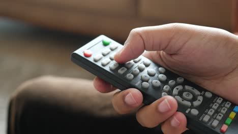 hand holding a remote control