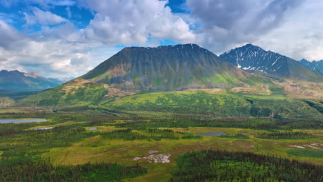 beautiful ridged mountains with little snow on the slopes. amazing nature of alaska from the drone footage