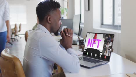 African-american-businessman-using-laptop-for-video-call-with-diverse-business-colleagues