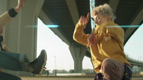 Young-Man-and-Woman-Dancing-Outdoors-in-City