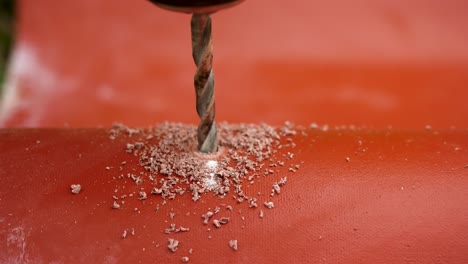 drilling a hole in a red material