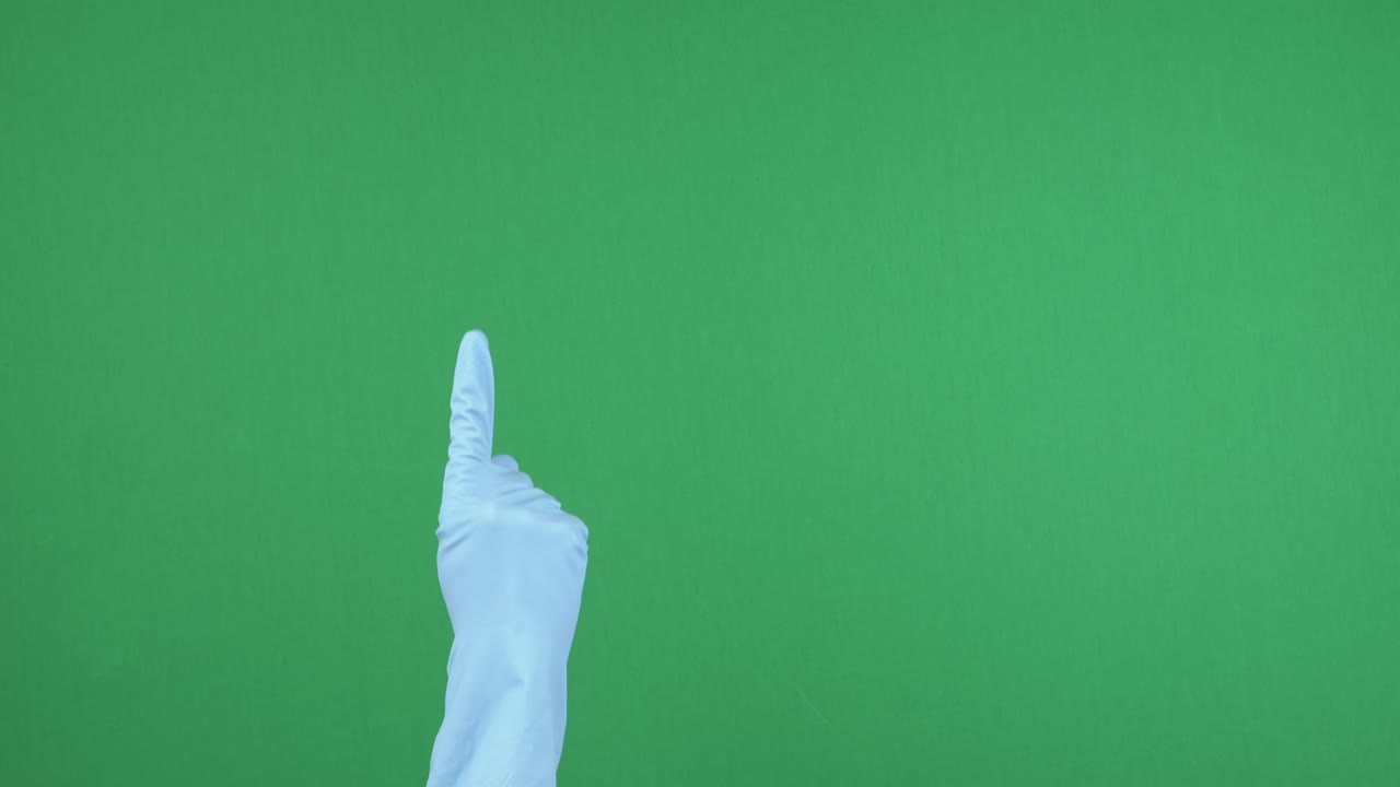 las manos con guantes de goma protectores azules se levantan y los dedos apuntan hacia arriba sobre el fondo de pantalla verde de la llave de croma vacía. gesto de la mano.