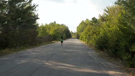 wide tracking shot of a young woman running