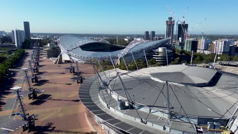 drone aerial view qudos bank arena accor sports stadium entertainment show ground concert venue football structure buildings cranes sydney olympic park nsw homebush bay australia 4k