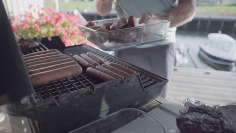 man cooking at barbecue during summer