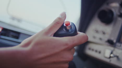 plane joystick. plane control panel. woman hand control lever of aircraft