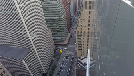 aerial birds eye overhead top down view of tall office of apartment buildings