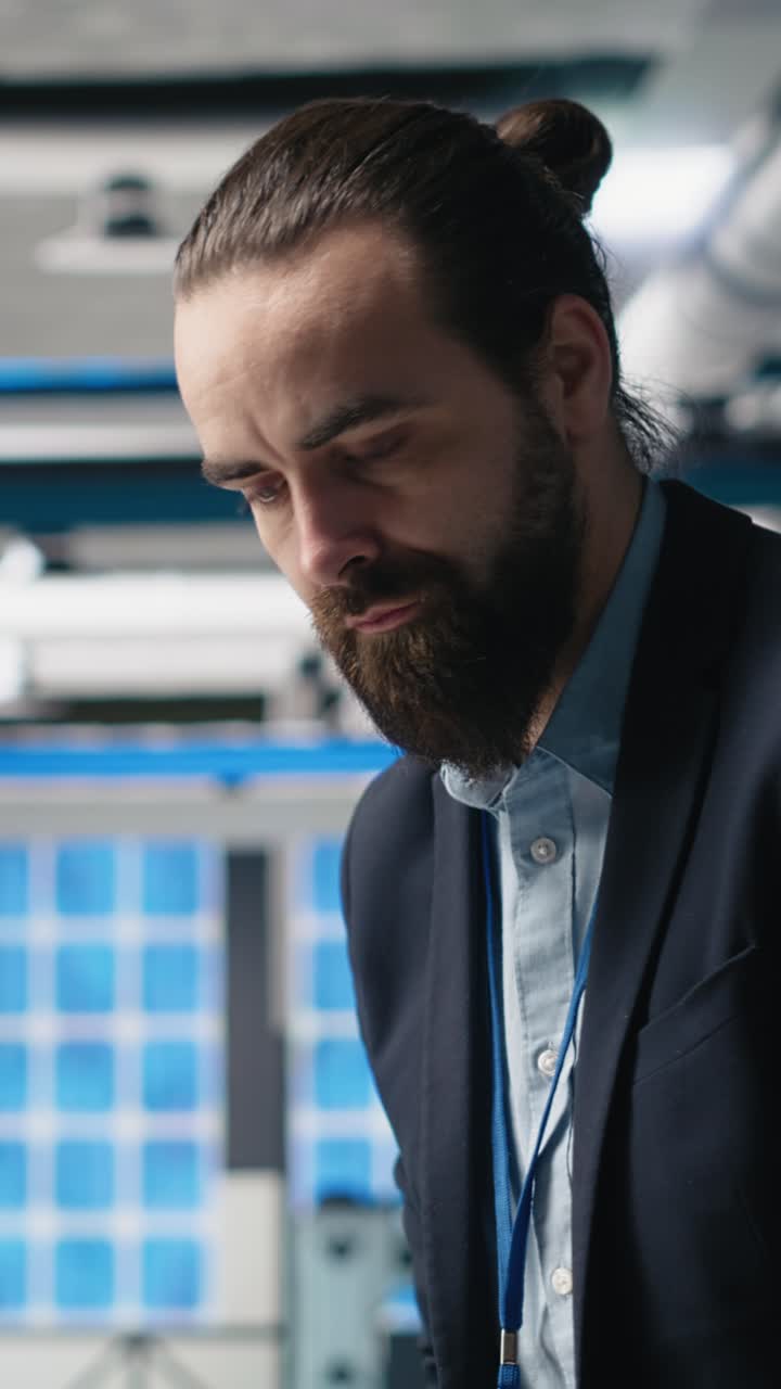 Vertical Video Executive consultant oversees solar energy systems in industrial workplace