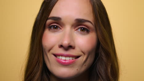 Surprised-woman-on-yellow-background.-Woman-laughing-at-camera