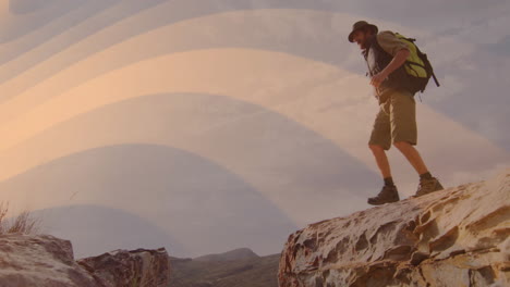 male hiker pausing at rocky canyon edge, showcasing marketing concept with golden gradient overlay