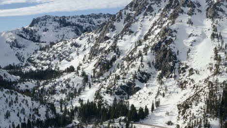 aerial of heavy snowfall on the mountains surrounding emerald bay lake tahoe