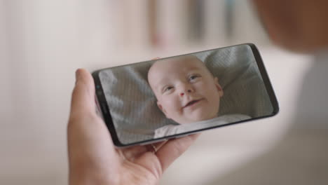 mother having video chat with baby using smartphone mom talking to toddler on mobile phone screen enjoying chat with child 4k footage