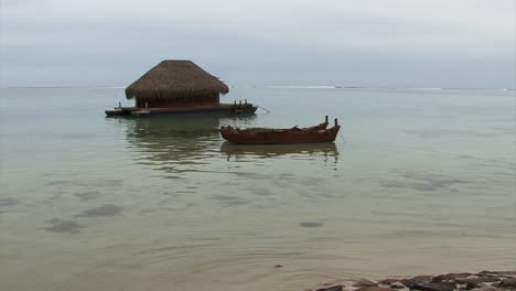 Floating-pontoon-houseboat,-Moorea,-French-Polynesia