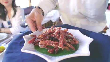 waiter carrying plates with meat dish, video in 4k