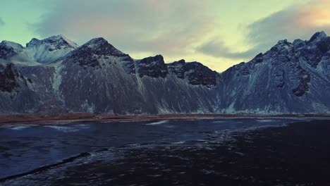 snowy mountains against sundown sky