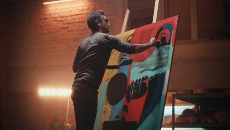 artist painting abstract art in a studio