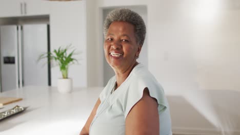 portrait of happy senior african american woman at home