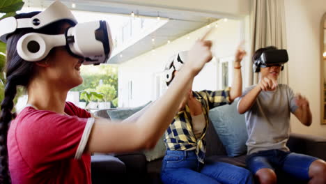 Playing together, family enjoying virtual reality headsets in living room