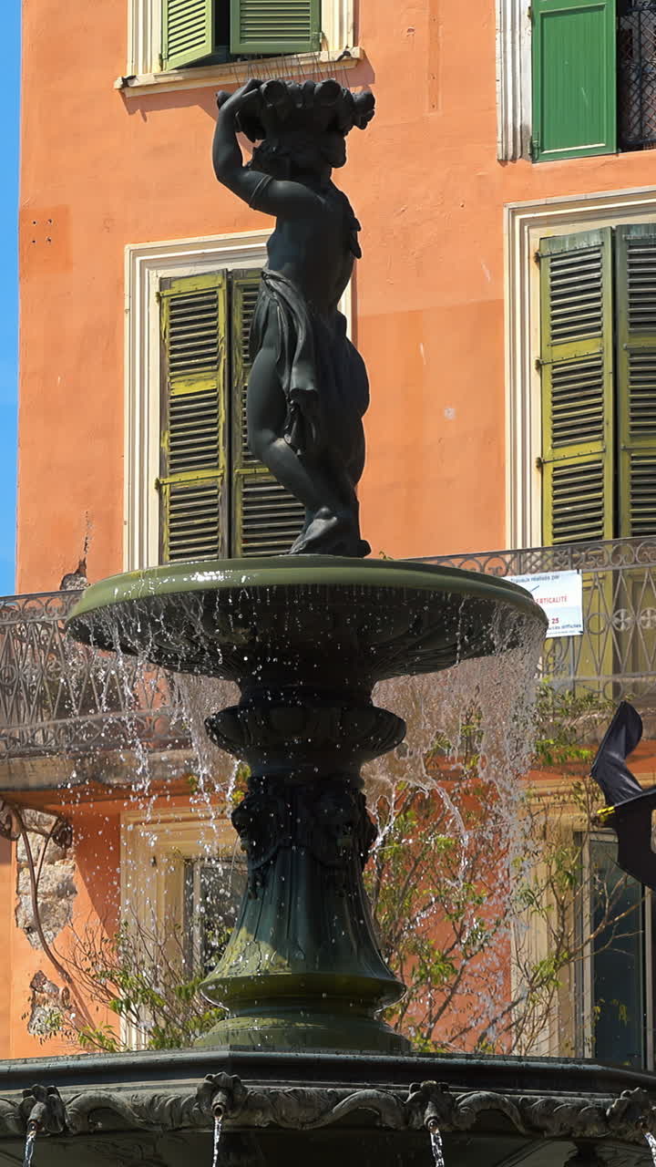 Woman statue water fountain at place du General de Gaulle street. Vertical, Cannes, France