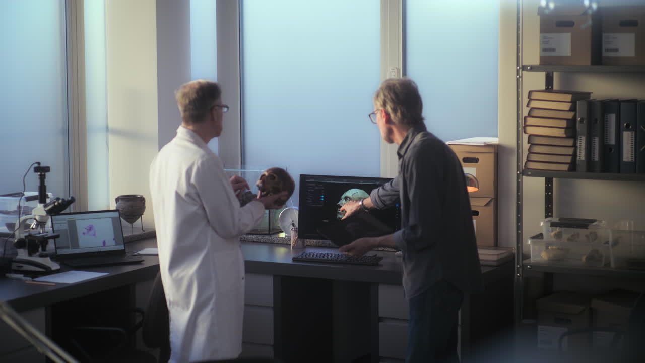 Scientists Examining a Skull and 3D Model in a Research Laboratory