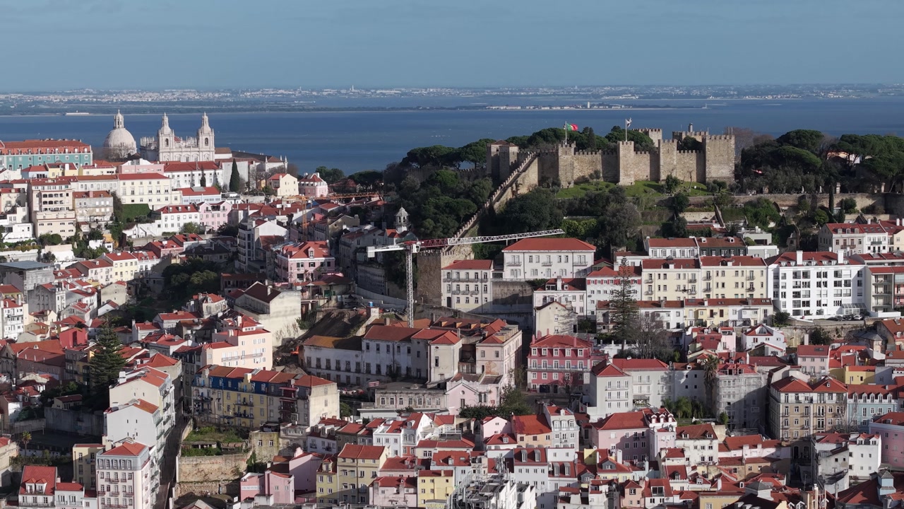 Castelo de Sao Jorge, Saint Georges Castle in Alfama district of Lisbon on Tagus river estuary, Drone shot