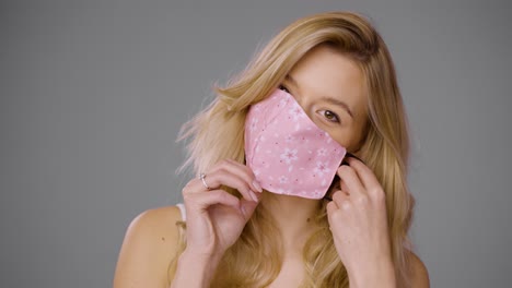 woman wearing a pink floral face mask