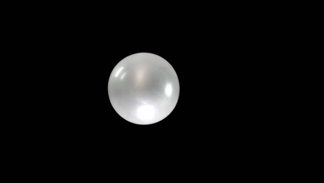 create a stunning visual with this slow-mo clip of a single silver balloon. the black background allows for seamless integration into your event video, perfect for festive or elegant party animations.