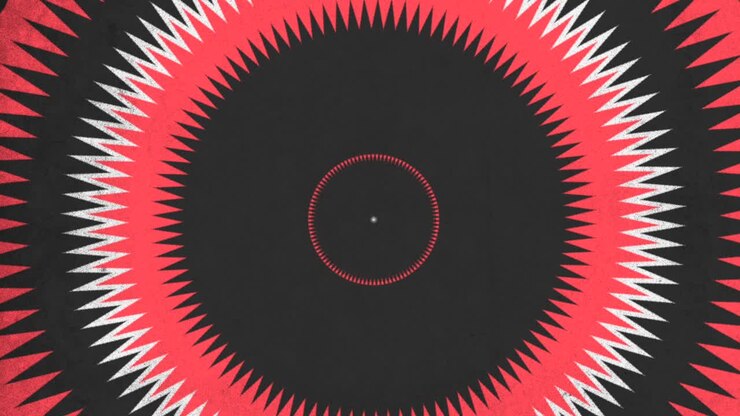 Cerchio rosso dinamico circondato da triangoli radiali bianchi e neri.
