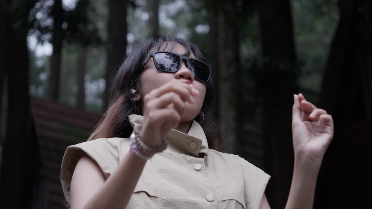 Cool looks, fashion apparel, young Asian girl, woodland cabin scene