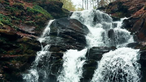 mountain waterfall with crystal clear water in forest. slow motion water