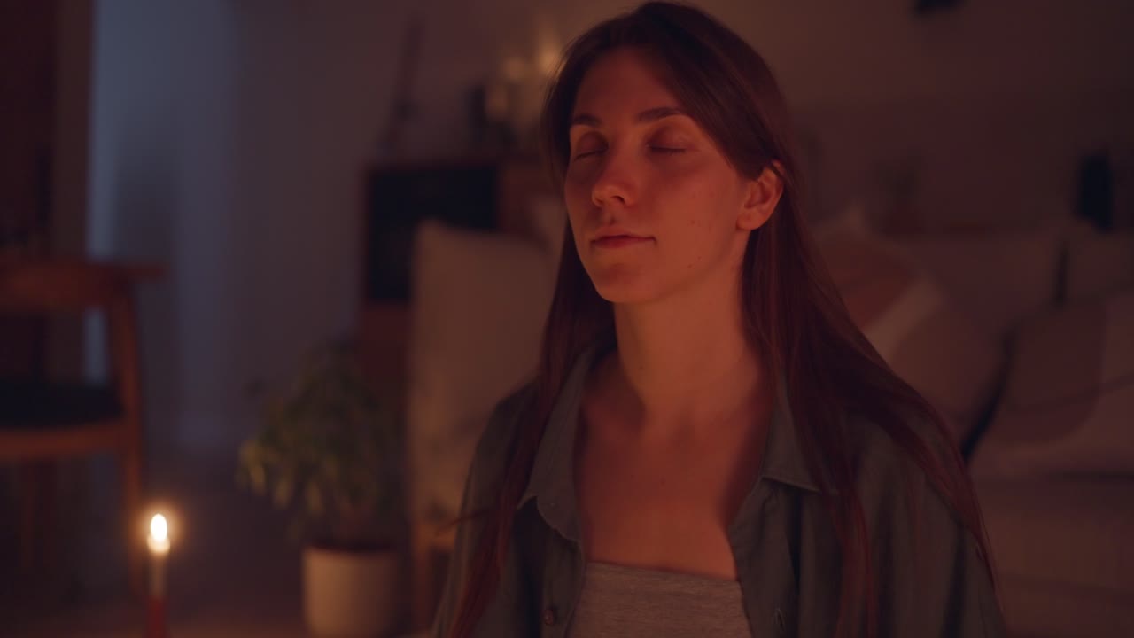 Woman Meditating in a Cozy Home