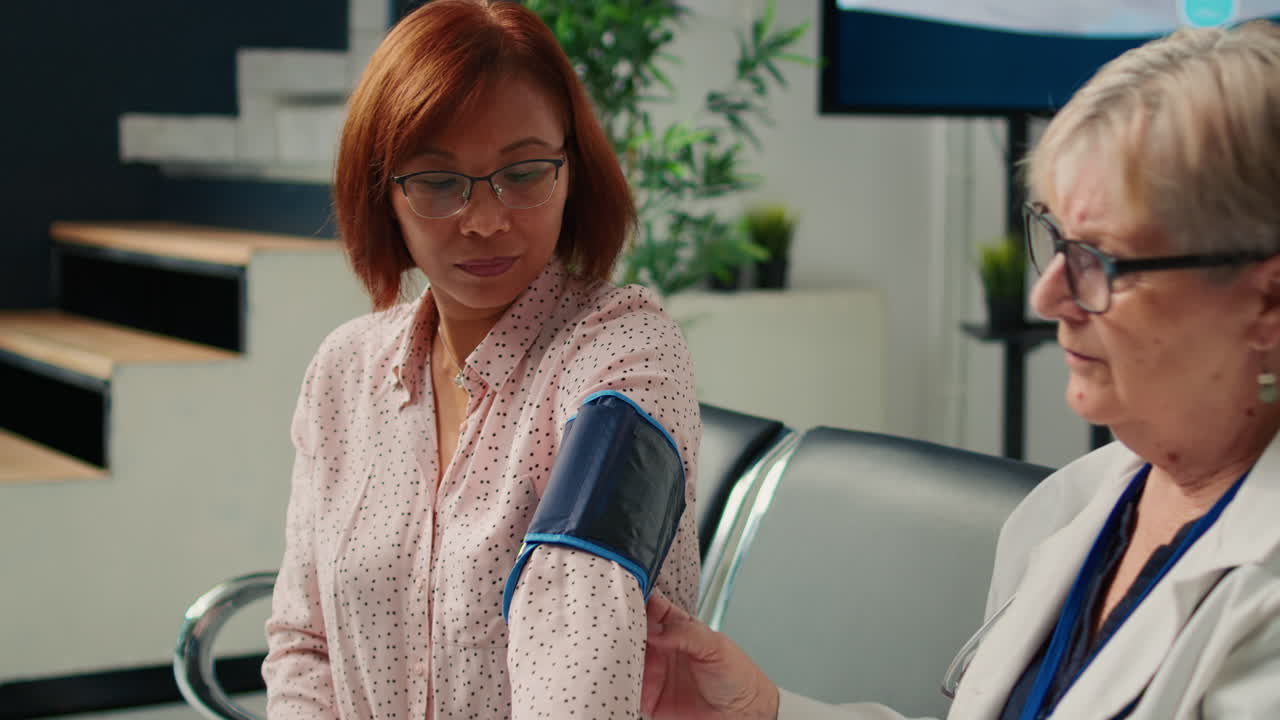 Doctor Checking Patient's Blood Pressure