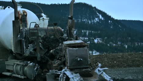 a burned-out fuel truck:a zoom shot at nighttime