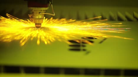 CNC-Laser-cutting-of-metal-in-slow-motion,-modern-industrial-technology.