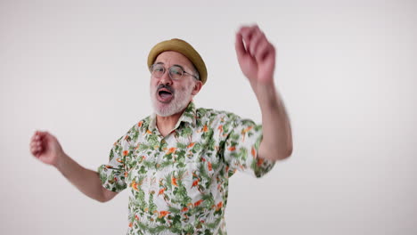 man dancing in hawaiian shirt and hat
