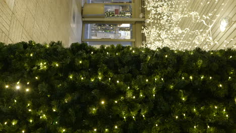 vertical pan left shot of christmas decoration in shopping mall