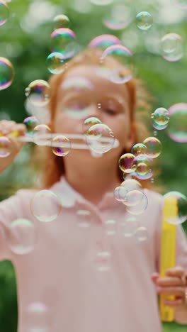 girl playing with bubbles