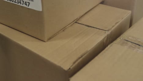 scanning a barcode on a box in a warehouse